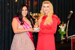 Lash Off Award winner, Bianca Martinez graciously accepts Lash-Off Award from Sophy Merszei, CEO, NovaLash